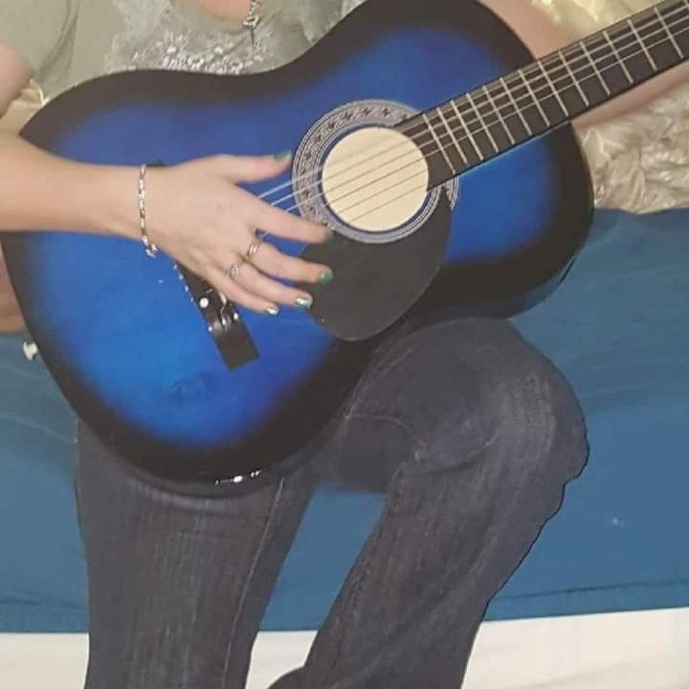 Acoustic guitar blue needs tuned